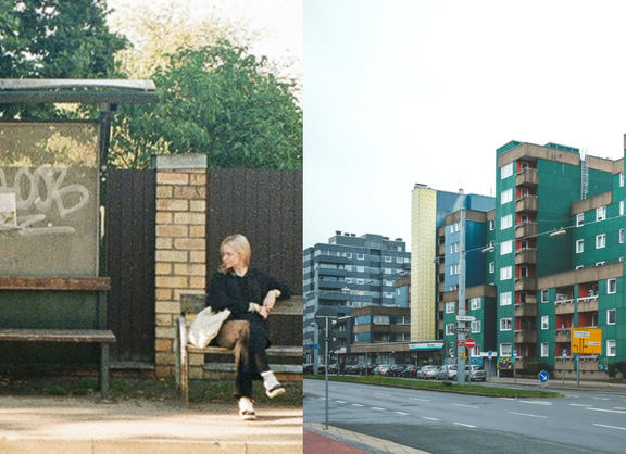 Auf der linken Bildseite ist eine Frau zu sehen, die an einer Bushhaltestelle, die mit Graffiti besprüht ist, wartet. Auf der rechten Bildseite ist ein Hochhaus-Block an einer Autostraße zu sehen.